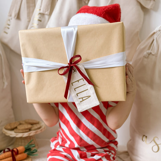 personalised Christmas gift tag, reusable canvas gift tag, personalised gift tag, Christmas present tag, fabric gift tag, canvas name tag, personalised name tag, reusable present tag, Christmas gift wrapping, neutral Christmas decor, warm sand gift tag, beige Christmas tag, vintage Christmas decor, kids Christmas gift tag, custom Christmas tag, personalised Christmas decor, sustainable gift wrapping, Christmas keepsake, stocking tag, Santa sack tag, Australian Christmas gifts