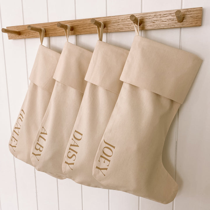 personalised Christmas stocking, warm sand Christmas stocking, beige Christmas stocking, natural Christmas stocking, neutral Christmas stocking, classic Christmas stocking, personalised kids stocking, personalised family stocking, canvas Christmas stocking, cotton Christmas stocking, custom name stocking, neutral Christmas decor, natural Christmas decor, coastal Christmas decor, Christmas keepsake, reusable Christmas stocking, children’s Christmas stocking, Australian Christmas decor