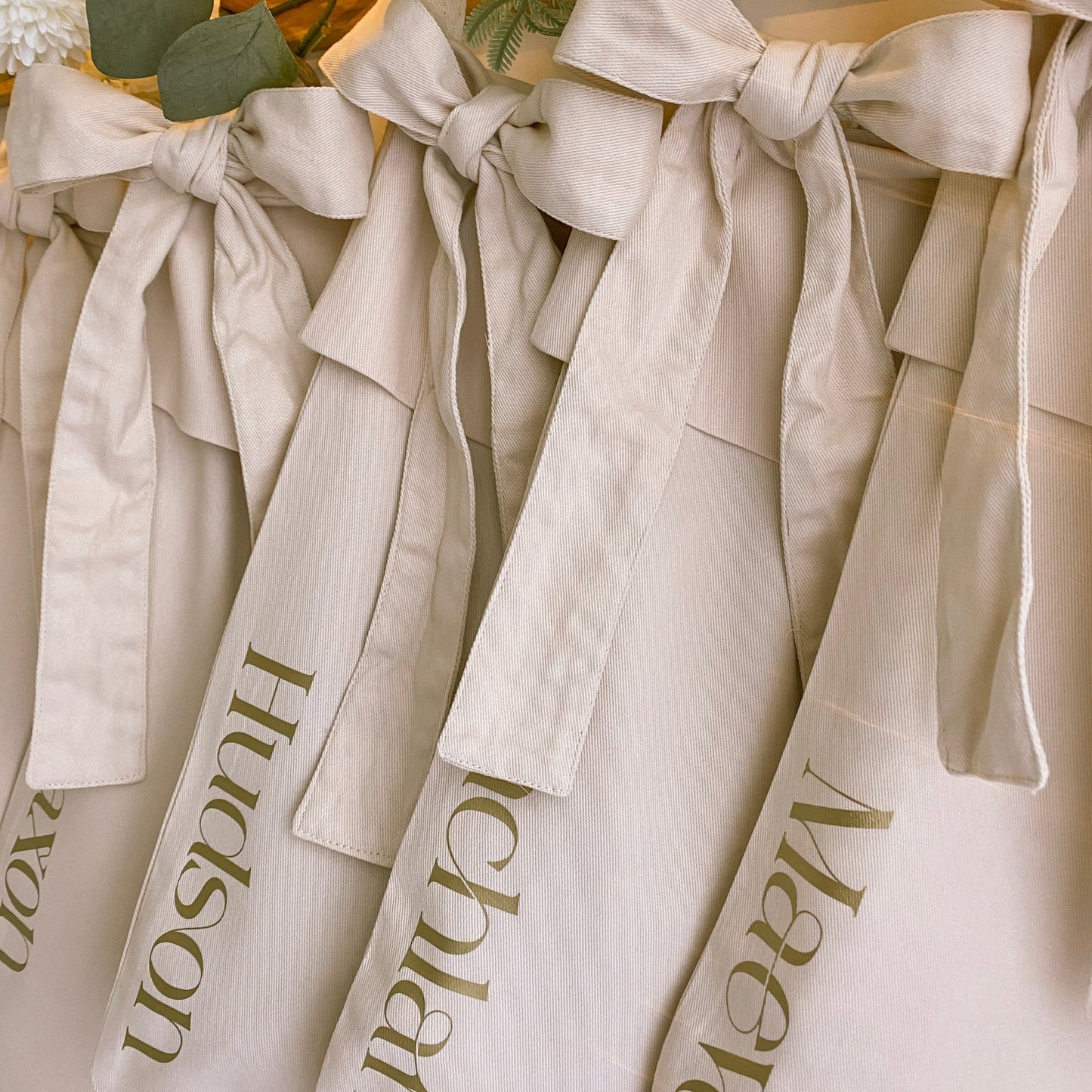 Personalised Christmas canvas bow stocking. Custom Christmas neutral stocking with bow. Minimalist bow Christmas stocking. Bow Name Christmas stocking. Personalised beige stocking with bow. Personalised cotton neutral bow stocking.