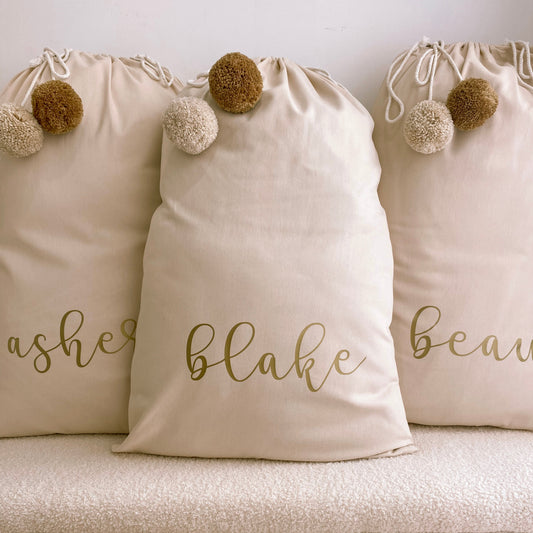 Vintage Christmas sack. Vintage Santa sack. Personalised pom Pom Christmas canvas Santa sack. Custom Christmas neutral Pom Pom present sack. Minimalist pom Pom Christmas sack. Cottagecore Name Christmas Santa sack. Personalised beige sack with Pom Poms. Personalised Cottagecore neutral santa sack.
