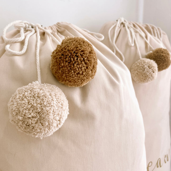 Vintage Christmas sack. Vintage Santa sack. Personalised pom Pom Christmas canvas Santa sack. Custom Christmas neutral Pom Pom present sack. Minimalist pom Pom Christmas sack. Cottagecore Name Christmas Santa sack. Personalised beige sack with Pom Poms. Personalised Cottagecore neutral santa sack.