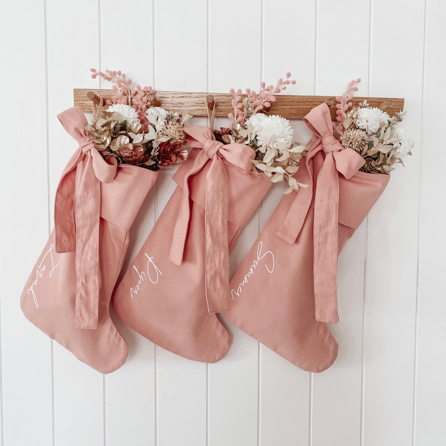 personalised pink bow Christmas stocking, pink Christmas stocking, personalised Christmas stocking, removable bow stocking, oversized bow stocking, canvas Christmas stocking, cotton Christmas stocking, custom name stocking, personalised kids stocking, pink Christmas decor, pastel Christmas decor, colourful Christmas decor, whimsical Christmas decor, cottagecore Christmas stocking, vintage Christmas stocking, Christmas keepsake, reusable Christmas stocking, Australian Christmas decor