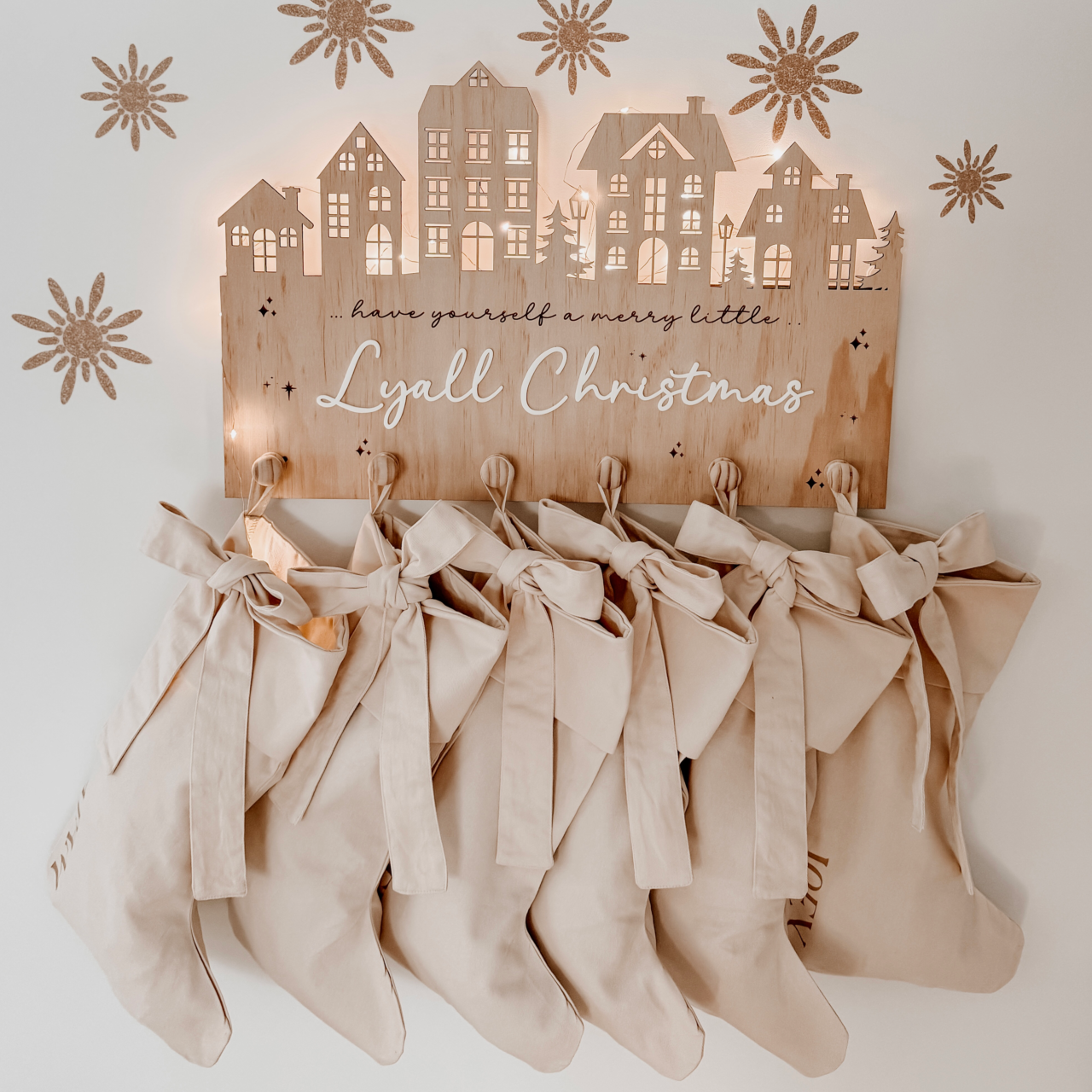 Personalised Christmas canvas bow stocking. Custom Christmas neutral stocking with bow. Minimalist bow Christmas stocking. Bow Name Christmas stocking. Personalised beige stocking with bow. Personalised cotton neutral bow stocking.
