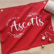 personalised Christmas banner, family Christmas banner, custom surname banner, Christmas wall hanging, personalised family decor, red Christmas decor, traditional Christmas decor, custom family sign, Christmas keepsake, Australian made Christmas decor, handmade Christmas banner, festive wall hanging, family name banner, personalised Christmas decorations, Christmas wall decor, reusable Christmas decor, family Christmas keepsake, red wall banner