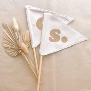 Neutral personalised pennant flag, Natural initial pennant, Personalised kids room decor, Personalised nursery decor, Alphabet initial flag, Neutral nursery decor, Beige kids bedroom decor, Natural kids room decor, Gender-neutral nursery decor, Minimal nursery accessories, Neutral personalised decor, Kids initial decor, Fabric pennant flag, Rental-friendly kids decor, Australian kids decor, Hello Saturday Kids Decor