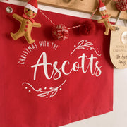 personalised Christmas banner, family Christmas banner, custom surname banner, Christmas wall hanging, personalised family decor, red Christmas decor, traditional Christmas decor, custom family sign, Christmas keepsake, Australian made Christmas decor, handmade Christmas banner, festive wall hanging, family name banner, personalised Christmas decorations, Christmas wall decor, reusable Christmas decor, family Christmas keepsake, red wall banner