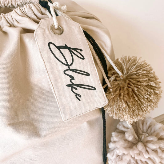 Personalised canvas gift tag. Personalised cotton gift tag. Custom gift tag. Fabric gift tag. Present name tag. Christmas personalised gift tag. Christmas name gift tag. Easter custom name tag. Easter personalised basket tag. Christmas sack name tag. Birthday personalised gift tag. Mother’s Day personalised name gift tag.