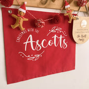 personalised Christmas banner, family Christmas banner, custom surname banner, Christmas wall hanging, personalised family decor, red Christmas decor, traditional Christmas decor, custom family sign, Christmas keepsake, Australian made Christmas decor, handmade Christmas banner, festive wall hanging, family name banner, personalised Christmas decorations, Christmas wall decor, reusable Christmas decor, family Christmas keepsake, red wall banner