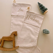 personalised Christmas stocking, warm sand Christmas stocking, beige Christmas stocking, natural Christmas stocking, neutral Christmas stocking, classic Christmas stocking, personalised kids stocking, personalised family stocking, canvas Christmas stocking, cotton Christmas stocking, custom name stocking, neutral Christmas decor, natural Christmas decor, coastal Christmas decor, Christmas keepsake, reusable Christmas stocking, children’s Christmas stocking, Australian Christmas decor