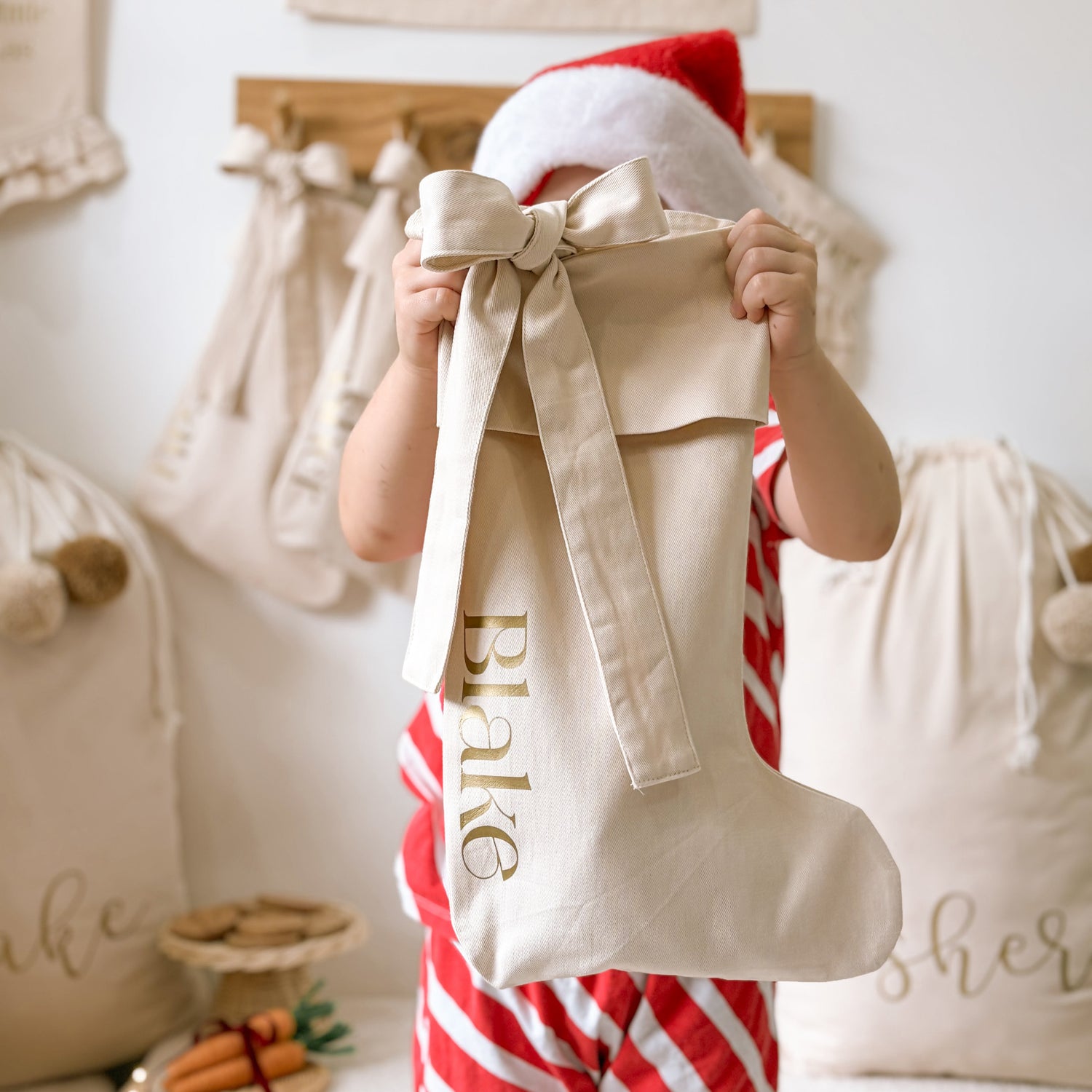 personalised bow Christmas stocking, warm sand Christmas stocking, beige bow stocking, neutral Christmas stocking, personalised Christmas stocking, removable bow stocking, oversized bow stocking, canvas Christmas stocking, cotton Christmas stocking, custom name stocking, personalised kids stocking, neutral Christmas decor, natural Christmas decor, cottagecore Christmas decor, vintage Christmas stocking, Christmas keepsake, reusable Christmas stocking, Australian Christmas decor