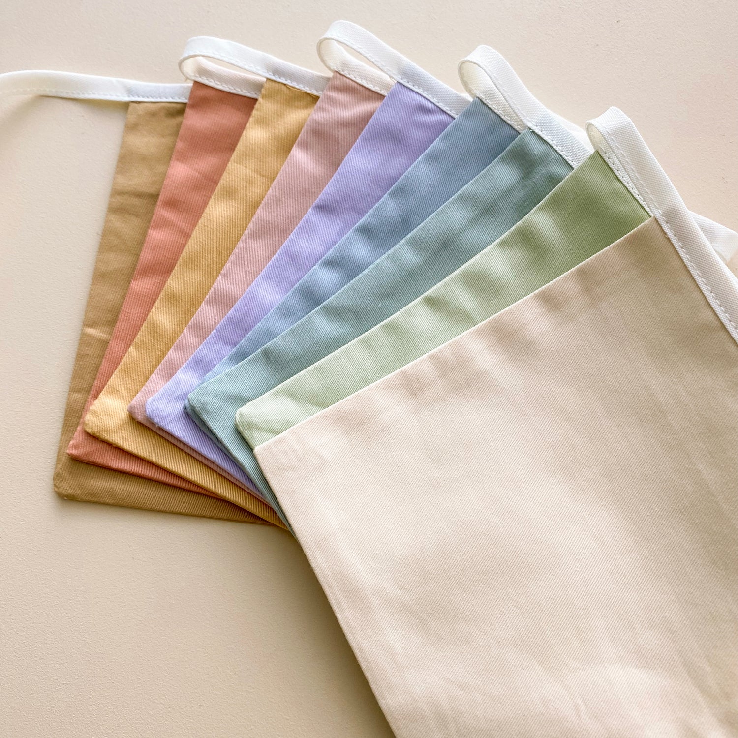 Soft rainbow bunting. Pastel square flag bunting. Kids nursery decor. Soft pastel kids bedroom styling. Pastel rainbow nursery. Modern kids nursery wall decor. Calm colourful playroom decor. Kids rental friendly decor. Minimalist rainbow bunting. Timeless nursery wall flags. Nursery garland. Rainbow garland. Gender neutral wall decor. Colourful wall garland. Colourful kids playroom decor.