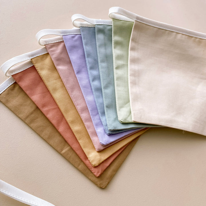 Muted rainbow bunting. Pastel square flag bunting. Kids nursery decor. Soft pastel kids bedroom styling. Neutral rainbow nursery. Modern kids nursery wall decor. Calm colour playroom decor. Kids rental friendly decor. Minimal rainbow bunting. Timeless nursery wall flags. Nursery garland. Rainbow garland.