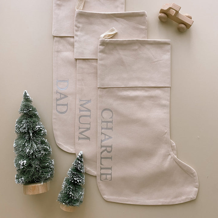 personalised Christmas stocking, warm sand Christmas stocking, beige Christmas stocking, natural Christmas stocking, neutral Christmas stocking, classic Christmas stocking, personalised kids stocking, personalised family stocking, canvas Christmas stocking, cotton Christmas stocking, custom name stocking, neutral Christmas decor, natural Christmas decor, coastal Christmas decor, Christmas keepsake, reusable Christmas stocking, children’s Christmas stocking, Australian Christmas decor