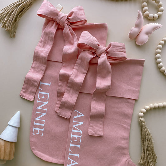 personalised pink bow Christmas stocking, pink Christmas stocking, personalised Christmas stocking, removable bow stocking, oversized bow stocking, canvas Christmas stocking, cotton Christmas stocking, custom name stocking, personalised kids stocking, pink Christmas decor, pastel Christmas decor, colourful Christmas decor, whimsical Christmas decor, cottagecore Christmas stocking, vintage Christmas stocking, Christmas keepsake, reusable Christmas stocking, Australian Christmas decor