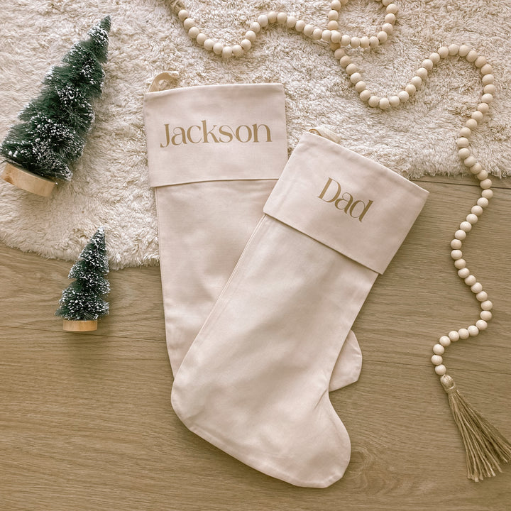 personalised Christmas stocking, warm sand Christmas stocking, beige Christmas stocking, natural Christmas stocking, neutral Christmas stocking, classic Christmas stocking, personalised kids stocking, personalised family stocking, canvas Christmas stocking, cotton Christmas stocking, custom name stocking, neutral Christmas decor, natural Christmas decor, coastal Christmas decor, Christmas keepsake, reusable Christmas stocking, children’s Christmas stocking, Australian Christmas decor
