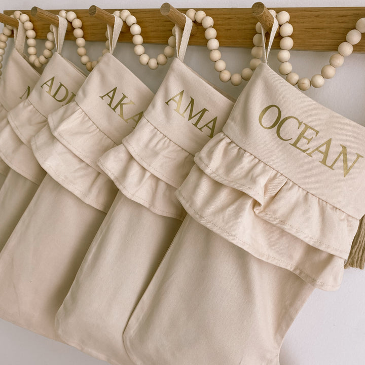 personalised frill Christmas stocking, double frill Christmas stocking, ruffle Christmas stocking, warm sand Christmas stocking, beige Christmas stocking, neutral Christmas stocking, personalised Christmas stocking, canvas Christmas stocking, cotton Christmas stocking, custom name stocking, personalised kids stocking, cottagecore Christmas decor, vintage Christmas stocking, neutral Christmas decor, Christmas keepsake, reusable Christmas stocking, Australian Christmas decor