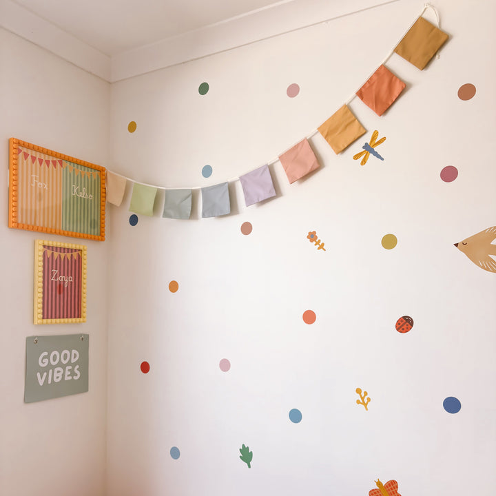 Muted rainbow bunting. Pastel square flag bunting. Kids nursery decor. Soft pastel kids bedroom styling. Neutral rainbow nursery. Modern kids nursery wall decor. Calm colour playroom decor. Kids rental friendly decor. Minimal rainbow bunting. Timeless nursery wall flags. Nursery garland. Rainbow garland.