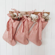 personalised pink bow Christmas stocking, pink Christmas stocking, personalised Christmas stocking, removable bow stocking, oversized bow stocking, canvas Christmas stocking, cotton Christmas stocking, custom name stocking, personalised kids stocking, pink Christmas decor, pastel Christmas decor, colourful Christmas decor, whimsical Christmas decor, cottagecore Christmas stocking, vintage Christmas stocking, Christmas keepsake, reusable Christmas stocking, Australian Christmas decor
