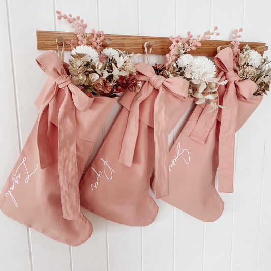 Personalised pink Christmas canvas bow stocking. Custom pink Christmas stocking with bow. pink bow Christmas stocking. Bow Name pink Christmas stocking. Personalised pink stocking with bow. Personalised cotton pink bow stocking.