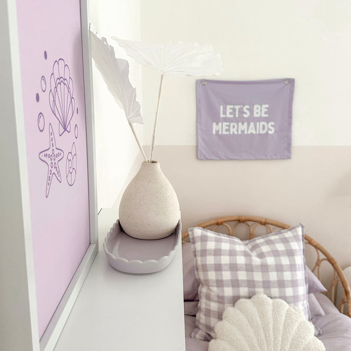 Purple girls room. Soft purple nursery decor. Classic girls bedroom styling. Sweet pastel purple bedroom decor. Seashell wall art. Whimsical girls room inspo. Magical girls bedroom decor. Mermaid inspired print decor. Timeless girls purple bedroom ideas. Elegant girls bedroom art. Girls feminine bedroom. Baby purple girls bedroom decor. Classic girls nursery decor. Classic purple bedroom. Delicate whimsical coastal inspired girls decor.