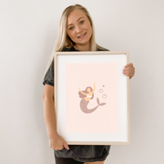 Pink girls room. Soft pink nursery decor. Classic girls bedroom styling. Sweet pastel pink bedroom decor. Mermaid wall art. Magical girls room inspo. Pink mermaid print decor. Timeless girls pink bedroom ideas. Elegant girls bedroom art. Girls feminine bedroom. Baby pink girls bedroom decor. Classic girls nursery decor. Classic pink bedroom. Delicate whimsical mermaid inspired girls decor.