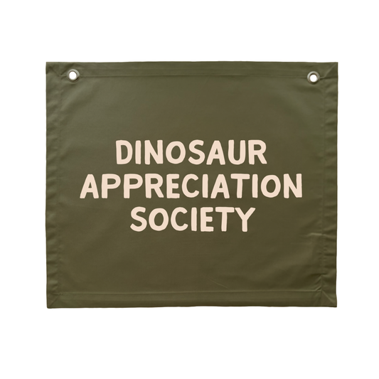 Olive green Dinosaur appreciation wall banner. Olive green Dino banner. Boys army green dinosaur bedroom styling. Boys green dinosaur bedroom wall decor. Boys bedroom Dino wall banner. Boys army green Dino themed wall decor. Boys dinosaur bedroom. Boys light green Dino bedroom decor ideas. 7 year old bedroom ideas. 10 year old bedroom ideas. 12 year old bedroom ideas. Olive green Dino nursery decor. Dinosaur nursery banner.