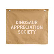Neutral tan Dinosaur appreciation wall banner. Tan Dino banner. Boys neutral dinosaur bedroom styling. Boys neutral dinosaur bedroom wall decor. Boys bedroom Dino wall banner. Boys Dino themed wall decor. Boys dinosaur bedroom. Boys tan Dino bedroom decor ideas. 7 year old bedroom ideas. 10 year old bedroom ideas. 12 year old bedroom ideas. Neutral Dino nursery decor. Dinosaur nursery banner. 