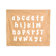 Gender neutral yellow kids room. Gender neutral bright nursery decor. Neutral Alphabet kids banner. Honey yellow abc banner. Boys alphabet wall banner. Surf boys yellow bedroom styling. Boys bright surf bedroom decor. Boys surf bedroom wall banner. Boys fun surf room inspo. Beach boys bedroom inspo. Beach boys bedroom ideas. Coastal boys bedroom inspo. ABC wall banner. Honey yellow boys bedroom decor.