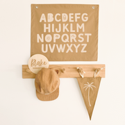 Gender neutral kids room. Gender neutral nursery decor. Neutral tan Alphabet kids banner. Boys brown abc banner. Boys alphabet wall banner. Surf boys bedroom styling. Boys surf bedroom decor. Boys surf bedroom wall banner. Boys surf room inspo. Beach boys bedroom inspo. Beach boys bedroom ideas. Coastal boys bedroom inspo. ABC wall banner. Neutral boys bedroom decor.