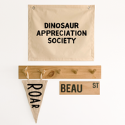 Neutral beige Dinosaur appreciation wall banner. Beige Dino banner. Boys neutral dinosaur bedroom styling. Boys neutral dinosaur bedroom wall decor. Boys bedroom Dino wall banner. Boys Dino themed wall decor. Boys dinosaur bedroom. Boys beige Dino bedroom decor ideas. 7 year old bedroom ideas. 10 year old bedroom ideas. 12 year old bedroom ideas. Neutral Dino nursery decor. Dinosaur nursery banner. 
