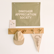 Sage green Dinosaur appreciation wall banner. Sage green Dino banner. Boys pale green dinosaur bedroom styling. Boys green dinosaur bedroom wall decor. Boys bedroom Dino wall banner. Boys fern green Dino themed wall decor. Boys dinosaur bedroom. Boys light green Dino bedroom decor ideas. 7 year old bedroom ideas. 10 year old bedroom ideas. 12 year old bedroom ideas. Sage green Dino nursery decor. Dinosaur nursery banner. 